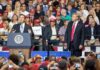 speaker at podium addressing crowd at political rally