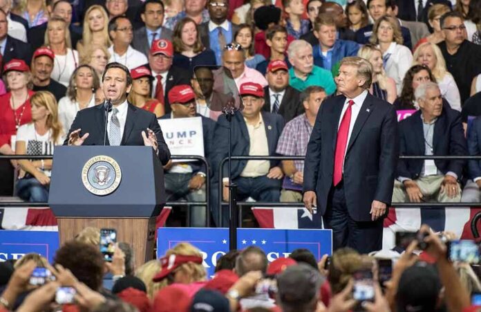 speaker at podium addressing crowd at political rally