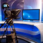 Television studio with camera and news desk