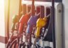 Fuel pump nozzles in multiple colors at a gas station