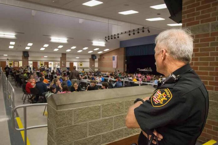 security officer overseeing a crowded school cafeteria