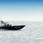 Police patrol boat speeding across open water