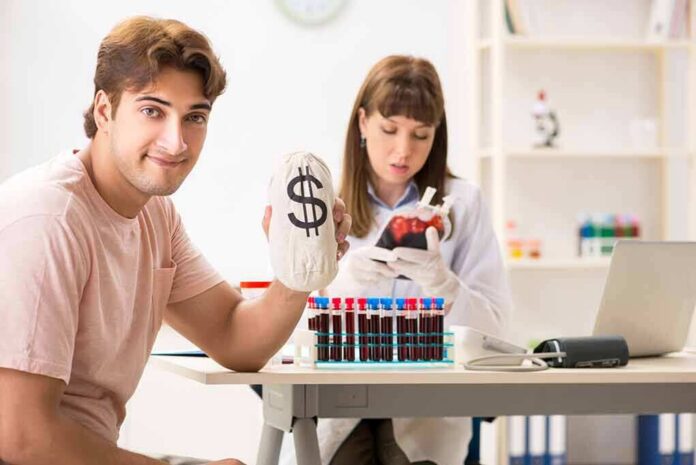 shutterstock_1275239965 Man holding money bag while technician handles blood bag
