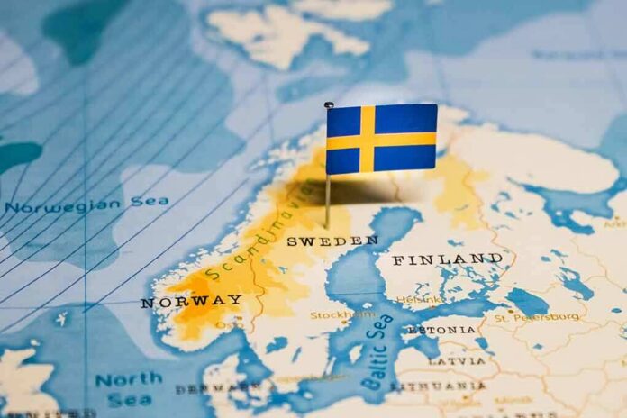 Sweden on a map with a small Swedish flag pin