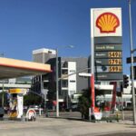 Shell gas station with price sign on a sunny day