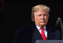 Donald Trump at a podium with a microphone