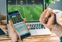 Person checking live soccer betting odds on a smartphone