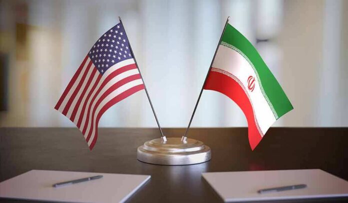 United States and Iran desk flags on a stand