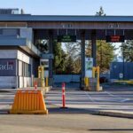 Canada border crossing booths with open and closed lane signs
