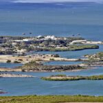 Aerial view of a coastal landscape featuring waterways and islands