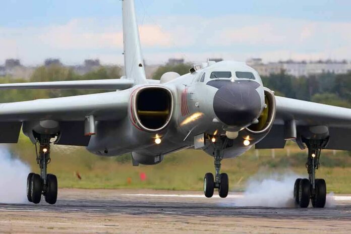 Military jet bomber landing on runway