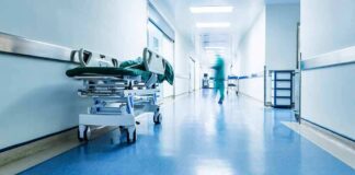 Hospital corridor with empty gurney