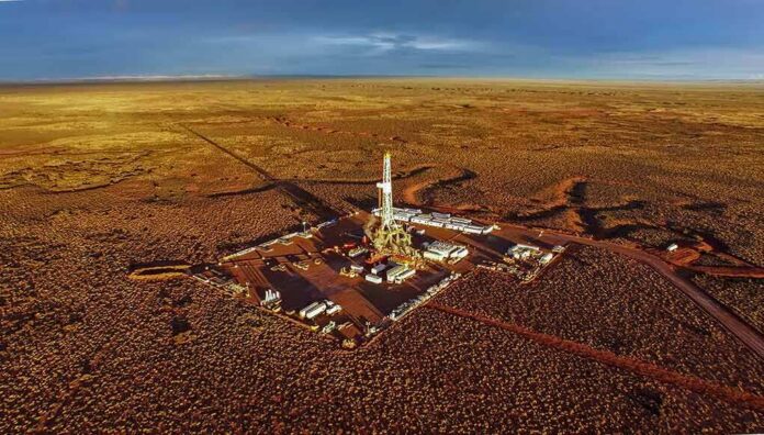Oil drilling rig at remote desert site