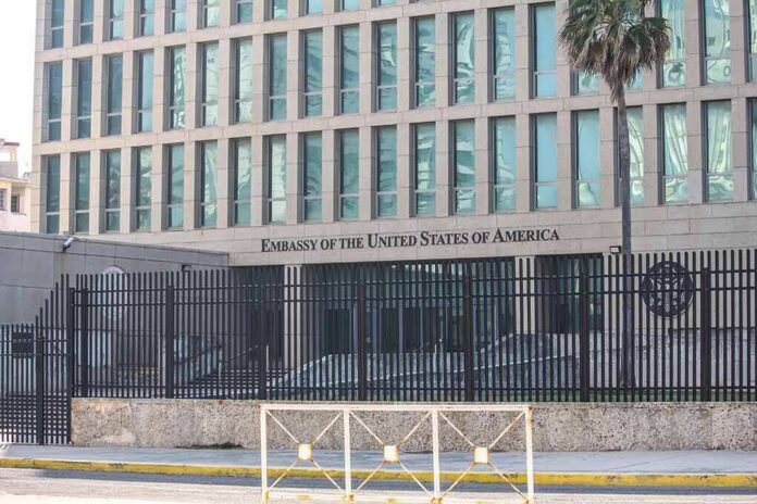 Embassy building behind tall black security fence
