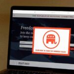 Laptop screen showing a political committee website with a popup featuring an elephant logo