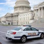 Police car parked outside the United States Capitol building