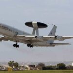 NATO AWACS aircraft taking off from an airfield