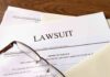 Judge SLAMS Paxton – ActBlue Gets Shielded Legal documents labeled lawsuit on a desk