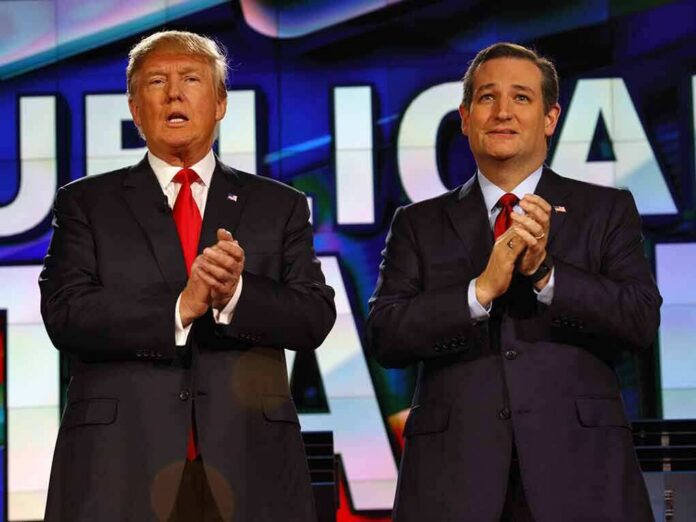 two men in suits clapping on a brightly lit stage