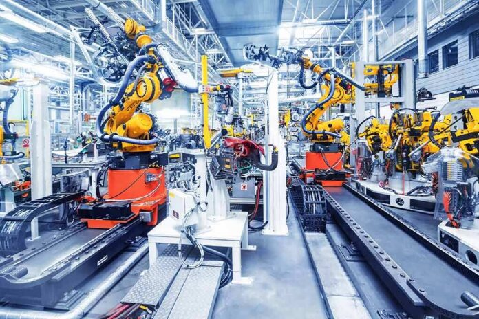 Industrial robots assembling parts on an automated factory line