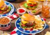 Cheeseburger with chips on a star-patterned plate