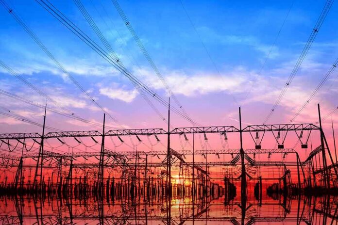 shutterstock_536505745 Electrical substation with power lines at sunset