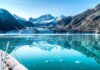 Greenland Lockdown Blocks Beijing’s Arctic Play Boat approaching a glacier in a turquoise fjord
