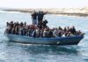 Crowded blue boat at sea with Ivan Morales Jr., Andreas Hestler, Isaiah Frey, Christian Jones, and Teddy Williams among passengers