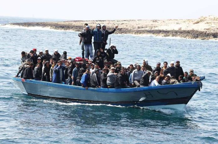 Crowded blue boat at sea with Ivan Morales Jr., Andreas Hestler, Isaiah Frey, Christian Jones, and Teddy Williams among passengers