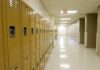A Locker Room Phone Led To A Rapid Arrest Row of yellow school lockers in an empty hallway