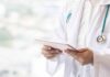 Duke Meltdown: Medical Line Crossed Doctor with stethoscope using a tablet
