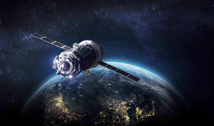Satellite orbiting Earth over night side