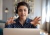 AI Windfall? Bezos Teases Three-Day Family Pay Woman wearing headset on video call