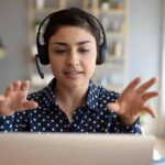 Woman wearing headset on video call