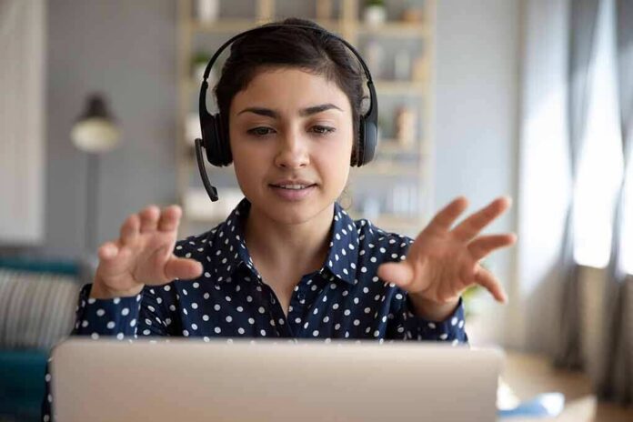 Woman wearing headset on video call