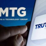 Smartphone showing Truth Social app icon beside TMTG logo on screen