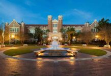 Homecoming Horror: Porch Drops, 28 Hurt Historic brick university building with central fountain at dusk