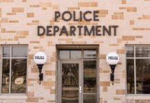 Police department building entrance with signage