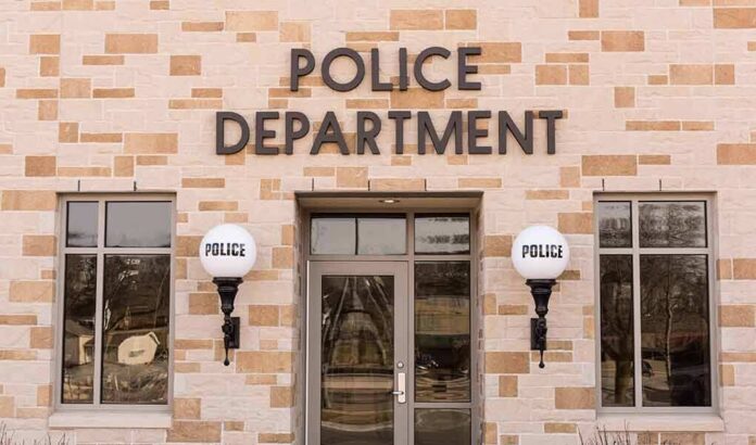 shutterstock_600837215 Police department building entrance with signage
