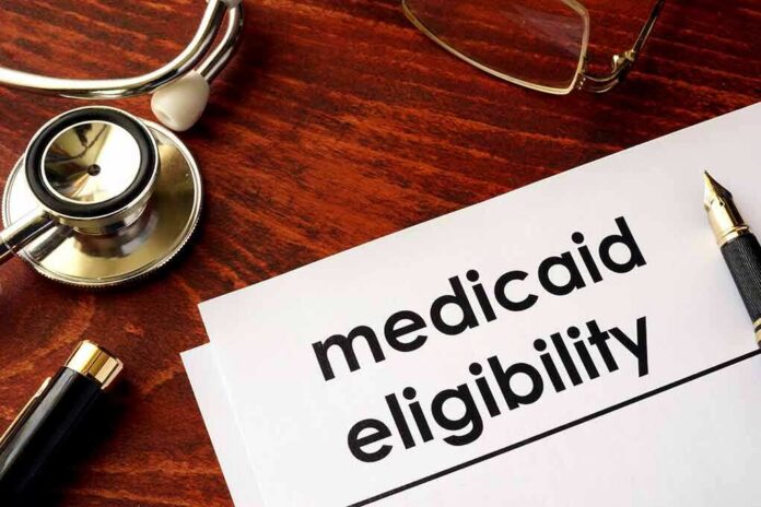 shutterstock_640488934-2 Medicaid eligibility form with stethoscope and pen on desk